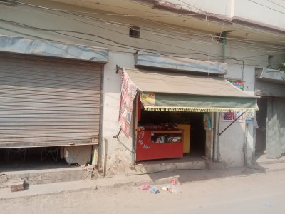 7 Marla Corner House Fully Marble with 3 Shops on SALE.